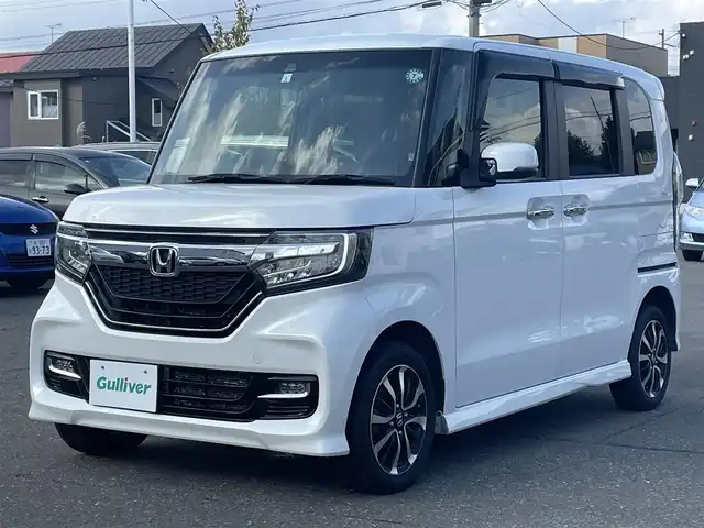 ホンダ Ｎ ＢＯＸ カスタム G L ホンダセンシング 道央・札幌 2019(平31)年 10.2万km プラチナホワイトパール 　４　W　D　/純正メモリナビ/（CD/DVD/FM/AM/SD/BT)/フルセグ（走行中視聴可能）/バックカメラ/ウィンカーミラー/クルーズコントロール/ドアバイザー/プッシュスタート/片側パワースライドドア/ビルトインETC/オートライト/フォグランプ/前席シートヒーター/コーナーセンサー（前）/ステアリングスイッチ/ベンチシート/フルフラットシート/チップアップシート/レーンキープアシスト/衝突軽減ブレーキ/横滑り防止装置/サイドエアバッグ/カーテンエアバッグ
