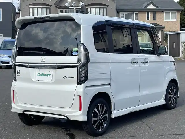 ホンダ Ｎ ＢＯＸ カスタム G L ホンダセンシング 道央・札幌 2019(平31)年 10.2万km プラチナホワイトパール 　４　W　D　/純正メモリナビ/（CD/DVD/FM/AM/SD/BT)/フルセグ（走行中視聴可能）/バックカメラ/ウィンカーミラー/クルーズコントロール/ドアバイザー/プッシュスタート/片側パワースライドドア/ビルトインETC/オートライト/フォグランプ/前席シートヒーター/コーナーセンサー（前）/ステアリングスイッチ/ベンチシート/フルフラットシート/チップアップシート/レーンキープアシスト/衝突軽減ブレーキ/横滑り防止装置/サイドエアバッグ/カーテンエアバッグ