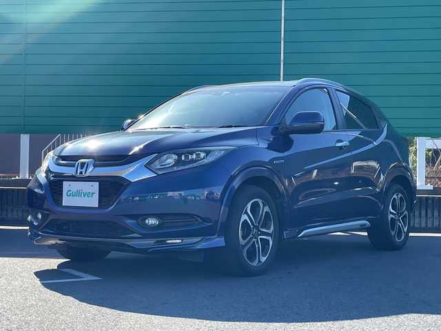 ホンダ ヴェゼル ハイブリッド Z 茨城県 2014(平26)年 5.6万km モルフォブルーP 社外ナビ/Bluetooth/フルセグTV/ドライブレコーダー/ETC/ハーフレザーシート/シートヒーター/横滑り防止装置/衝突軽減システム/オートライト/LEDヘッドライト/純正OPモデューロエアロパーツ/保証書/取扱説明書