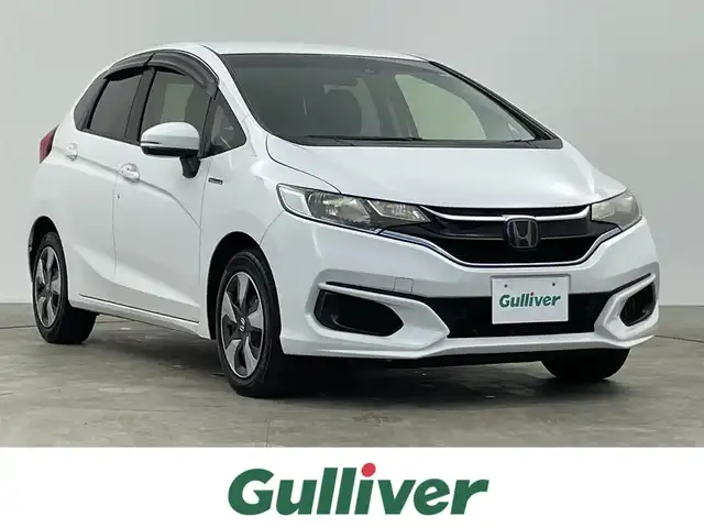 ホンダ フィット ハイブリット F 千葉県 2018(平30)年 7.5万km タフタホワイトⅢ ホンダセンシング/・衝突軽減ブレーキ/・誤発進抑制機能/・歩行者事故低減ステアリング/・路外逸脱抑制機能/・アダプティブ・クルーズ・コントロール/・車線維持支援システム/・先行車発進お知らせ機能/・標識認識機能/純正7インチメモリーナビ/・CD/DVD再生/・Bluetooth接続/プッシュスタート/スマートキー/ドアバイザー/ヘッドライトレベライザー/純正フロアマット/ドアバイザー