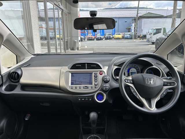 ホンダ フィット ハイブリット ナビ プレミアムセレクション 大阪府 2010(平22)年 7.2万km クリスタルブラックパール 純正ＨＤＤナビ/（ＣＤ／ＤＶＤ）/バックカメラ/純正フロアマット/純正１５インチアルミキャップ/ＥＴＣ/保証書/取扱説明書/記録簿/スペアキー