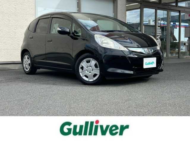 ホンダ フィット ハイブリット ナビ プレミアムセレクション 大阪府 2010(平22)年 7.2万km クリスタルブラックパール 純正ＨＤＤナビ/（ＣＤ／ＤＶＤ）/バックカメラ/純正フロアマット/純正１５インチアルミキャップ/ＥＴＣ/保証書/取扱説明書/記録簿/スペアキー