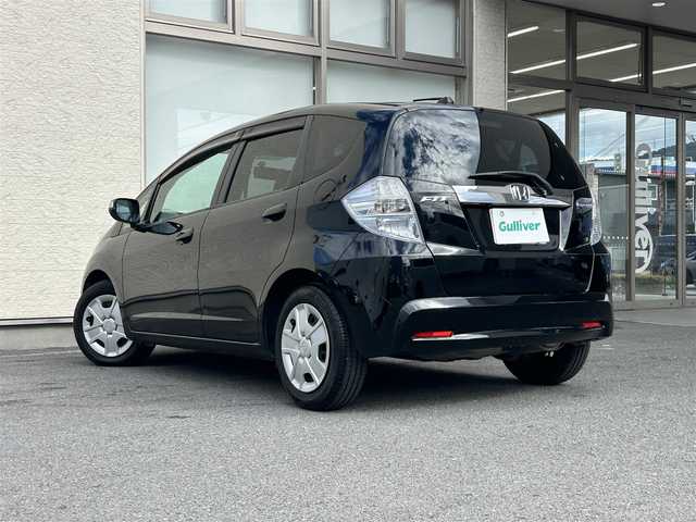 ホンダ フィット ハイブリット ナビ プレミアムセレクション 大阪府 2010(平22)年 7.2万km クリスタルブラックパール 純正ＨＤＤナビ/（ＣＤ／ＤＶＤ）/バックカメラ/純正フロアマット/純正１５インチアルミキャップ/ＥＴＣ/保証書/取扱説明書/記録簿/スペアキー