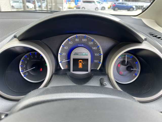 ホンダ フィット ハイブリット ナビ プレミアムセレクション 大阪府 2010(平22)年 7.2万km クリスタルブラックパール 純正ＨＤＤナビ/（ＣＤ／ＤＶＤ）/バックカメラ/純正フロアマット/純正１５インチアルミキャップ/ＥＴＣ/保証書/取扱説明書/記録簿/スペアキー