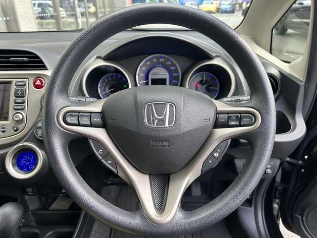 ホンダ フィット ハイブリット ナビ プレミアムセレクション 大阪府 2010(平22)年 7.2万km クリスタルブラックパール 純正ＨＤＤナビ/（ＣＤ／ＤＶＤ）/バックカメラ/純正フロアマット/純正１５インチアルミキャップ/ＥＴＣ/保証書/取扱説明書/記録簿/スペアキー