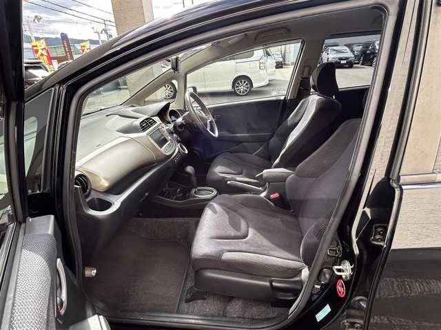 ホンダ フィット ハイブリット ナビ プレミアムセレクション 大阪府 2010(平22)年 7.2万km クリスタルブラックパール 純正ＨＤＤナビ/（ＣＤ／ＤＶＤ）/バックカメラ/純正フロアマット/純正１５インチアルミキャップ/ＥＴＣ/保証書/取扱説明書/記録簿/スペアキー