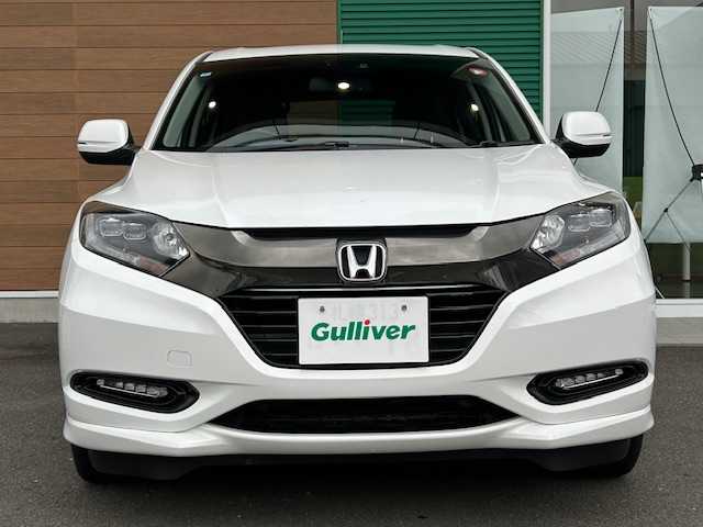 ホンダ ヴェゼル ハイブリッド Z ホンダセンシング 静岡県 2016(平28)年 14.5万km ホワイトオーキッドパール ETC/純正ナビ/Bluetooth/スポーツモード/ブレーキホールド/AWD/パドルシフト/アダプティブクルーズコントロール/レーンキープアシスト/シートヒーター/純正アルミホイール/ハイブリッド専用デザインメーター/ホンダセンシング/LEDフォグライト/ルーフレール（FF)/エンジンスターター