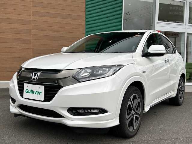 ホンダ ヴェゼル ハイブリッド Z ホンダセンシング 静岡県 2016(平28)年 14.5万km ホワイトオーキッドパール ETC/純正ナビ/Bluetooth/スポーツモード/ブレーキホールド/AWD/パドルシフト/アダプティブクルーズコントロール/レーンキープアシスト/シートヒーター/純正アルミホイール/ハイブリッド専用デザインメーター/ホンダセンシング/LEDフォグライト/ルーフレール（FF)/エンジンスターター