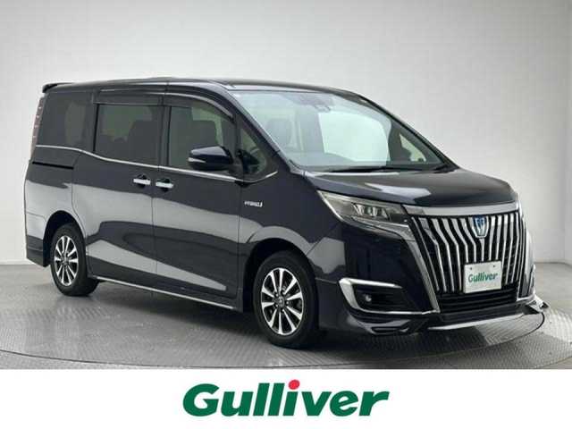 トヨタ エスクァイア ハイブリッド Gi 兵庫県 2018(平30)年 5.6万km スパークリングブラックパールクリスタルシャイン 純正メモリナビ(CD/DVD/Bluetooth/フルセグ/SD)/バックカメラ/両側パワースライドドア/社外エアロ/純正15インチアルミホイール/純正フロアマット/レザーシート/シートヒーター/クルーズコントロール/オートライト/オートマチックハイビーム/LEDヘッドライト/LEDフォグライト/ビルトインETC2.0