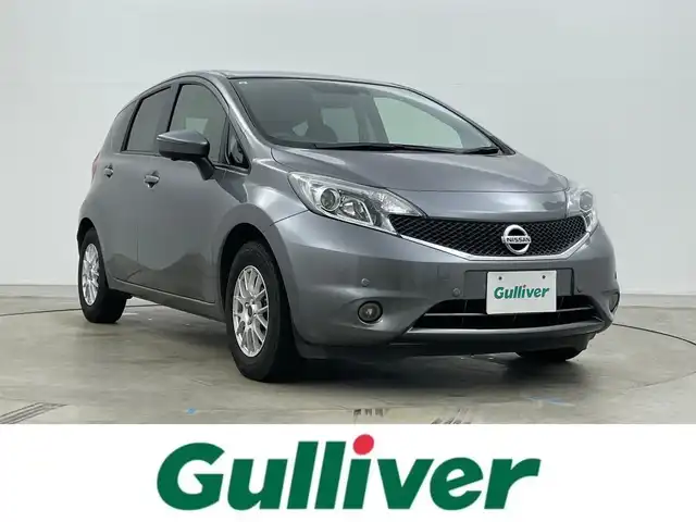 日産 ノート X DIG－S Vセレ +セーフ 岡山県 2015(平27)年 6.8万km ダークメタルグレー 純正7インチナビ/「BT/CD/DVD/フルセグTV/USB」/型番:MC315D-W/アラウンドビューモニター/LEDヘッドライト/オートライト/ＥＴＣ/衝突軽減ブレーキシステム/横滑り防止装置　/社外１４インチアルミ　/コーナーセンサー（前後）/スマートキー×1/プッシュスタート