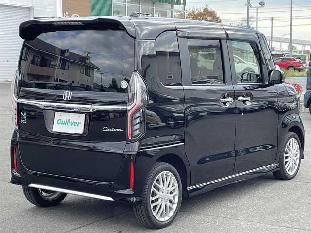 ホンダ Ｎ ＢＯＸ カスタム L ターボ 道央・札幌 2023(令5)年 1.2万km クリスタルブラックパール 登録時走行距離12001km/ワンオーナー/　４　W　D　/寒冷地仕様/ターボ/ホンダセンシング/　・レーンキープアシスト/　・衝突軽減ブレーキ/　・誤発進抑制機能/　・後方誤発進抑制機能/　・歩行者事故軽減ステアリング/　・先行車発進お知らせ機能/　・オートハイビーム/純正ナビ（CD/DVD/FM/AM/SD/BT)/フルセグ（走行中視聴可能）/バックカメラ/フロントカメラ/ウィンカーミラー/クルーズコントロール（追従走行あり）/アイドリングストップ/ドアバイザー/プッシュスタート/両側パワースライドドア/ETC/ドライブレコーダー/スペアキー×１/純正エンジンスターター/ベンチシート/純正フロアマット/シートヒーター（運転席/助手席）/横滑り防止装置/盗難防止装置/フォグランプ/ステアリングスイッチ/革巻きステアリング/イルミネーションコントロール/ECONスイッチ/ワイパー間欠時間コントローラー/パドルシフト/MTモード付AT/ミラーヒーター/プラズマクラスター搭載エアコン/ヘッドライトレベライザー/シートバックテーブル