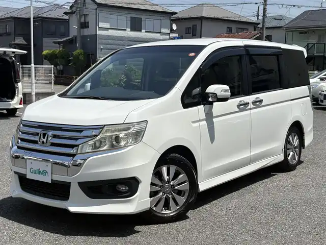 ホンダ ステップワゴン スパーダ Z 埼玉県 2014(平26)年 9.1万km ホワイトオーキッドパール ・ディーラー点検記録複数年有/・ワンオーナー　/コンフォートビューパッケージ/［親水/ヒーテッドドアミラー+フロントドア撥水ガラス］/・ナビ装着用スペシャルパッケージ/・純正9インチプレミアムインターナビTV　DVD BT　/・バックカメラ　/・ＥＴＣ　/・両側パワースライドドア　/・リア両側イージードアクローザー/・オートライト　/ディスチャージヘッドライト＜HID＞/（ロービーム、オートレベリング/オートライトコントロール機構付）　/・アクティブコーナリングライト/・フォグライト　　/・クルーズコントロール　/・パドルシフト/・Hondaスマートキーシステム（Hondaスマートキー2個付）/・１６インチアルミホイール＋スチールラジアルタイヤ（205/60R16 92H　ＢＳレグノサマータイヤ）/・クルーズコントロール/・スーパーＵＶカットフロントドアガラス/・保証書/・取説