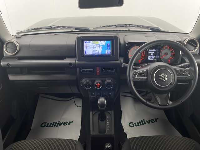 スズキ ジムニー XC 宮崎県 2018(平30)年 4.6万km ジャングルグリーン 禁煙車/パートタイム4WD/衝突被害軽減ブレーキ/社外ナビTV/（MDV-D406BT/CD/Bluetooth/FMAM/ワンセグTV)/社外バックカメラ/社外ETC/純正マッドガード/純正LEDオートライト/純正フォグ/純正16インチアルミ/純正セキュリティアラーム/クルーズコントロール/レーンディパーチャーアラート/ダウンヒルアシストコントロール/シートヒーター/オートエアコン/ウインカードアミラー/本革巻ハンドル/スマートキー/プッシュエンジンスタート/新車時保証書/取扱い説明書