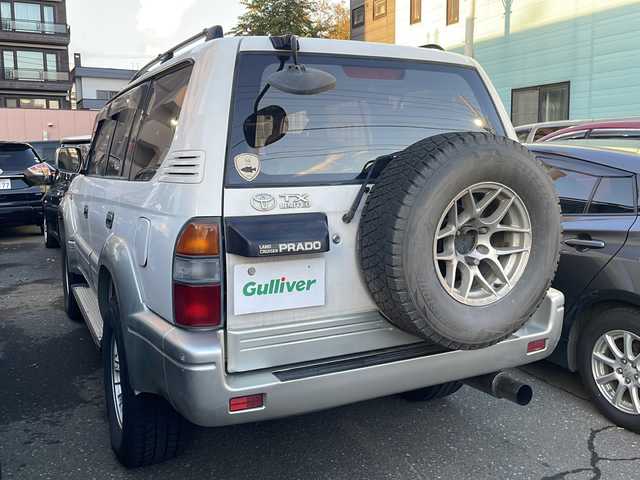 トヨタ ランドクルーザー プラド TX－LTD ワイド 道央・札幌 1999(平11)年 16.1万km ホワイトパールクリスタルシャイン 純正オーディオ（AM/FM/CD/MD）/マルチインフォメーションディスプレイ/オートエアコン/サンルーフ（手動）/バックカメラ（ミラー型）/レーダー探知機（品番ZVR-175N）/エアバッグ（前席）/車載用ロッドホルダー/3列シート/フォグランプ/セキュリティコードナビゲーション/リアヒーター/ルーフレール/パワーモード/2速スタートモード/アイドルアップ/純正フロアマット/パワーウィンドウ/電動格納ミラー