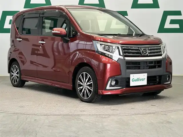 ダイハツ ムーヴ カスタム X ハイパー SAⅡ 鹿児島県 2015(平27)年 6万km ファイアークォーツレッドM スマートアシストII/・衝突警報機能/・衝突回避支援ブレーキ機能/・車線逸脱警報機能/・誤発進抑制機能(前方)/・誤発進抑制機能(後方)/・先行車発進お知らせ機能/純正SDナビ【NSZN-W65D】/（CD/DVD/フルセグ/Bluetooth）/社外ETC/ステアリングリモコン/ハーフレザーシート/アイドリングストップ/純正LEDヘッドライト/フロントフォグランプ/オートライト/電動格納ミラー/純正フロアマット/純正14インチアルミ/純正ドアバイザー/取扱説明書