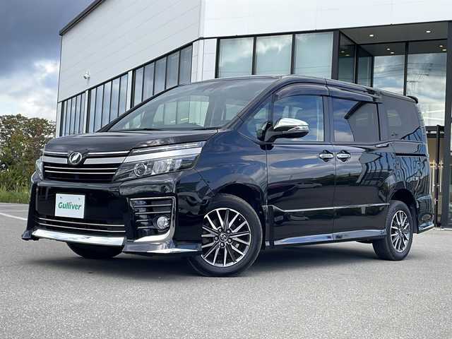 トヨタ ヴォクシー ZS 煌Ⅱ 青森県 2016(平28)年 6.3万km ブラック ・4WD/・ALPINE9インチ ナビ/・フルセグ/BT/CD/DVD/・バックカメラ/・両側パワースライドドア/・衝突軽減装置/・横滑り抑制装置/・レーンキープアシスト/・ビルトインETC/・前方ドライブレコーダー/・プッシュスタート/・スマートキー/・USB端子/・オートマチックハイビーム/・純正フロアマット/・7人乗り/・スペアキー/・純正16AW