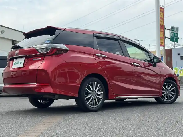 ホンダ シャトル ハイブリッド Z ホンダセンシング 千葉県 2019(令1)年 2.4万km プレミアムクリスタルレッドM ワンオーナー/ホンダセンシング/衝突被害軽減ブレーキ/車線維持支援システム/アダプティブクルーズコントロール/純正メモリーナビ/フルセグTV/Bluetooth/バックカメラ/CD・DVD再生機能/ビルトインETC/ドライブレコーダー/ハーフレザーシート/D+N席シートヒーター/LEDライト/ETC/カーテンエアバッグ/パドルシフト/純正フロアマット/純正16インチアルミホイール/純正ドアバイザー/プッシュスタート/スマートキー/取扱説明書＆保証書