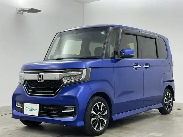 ホンダ Ｎ ＢＯＸ カスタム G L ホンダセンシング 岡山県 2020(令2)年 6万km ブリリアントスポーティブルーメタリック2トーン 純正メモリナビゲーション		/【フルセグ/Bluetooth/DVD】		/バックカメラ		/純正14inアルミホイール+サマータイヤ：装着			/レーダークルーズコントロール		/ビルトインETC		/LEDヘッドライト（AUTO機能付き）		/シートヒーター		/横滑り防止機能		/衝突軽減システム		/車線逸脱防止システム		/社外ドライブレコーダー		/ステアリングリモコン				/スマートキー				/プッシュスタート						/フロアマット