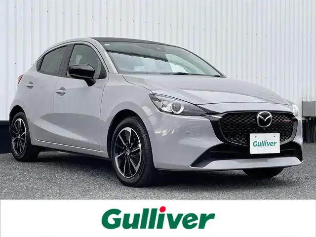 マツダ マツダ２ 15スポルト 千葉県 2024(令6)年 1.9万km グレー 純正8インチナビ/(フルセグTV/BT/FM/AM)/全周囲カメラ/前後ドライブレコーダー/ヘッドアップディスプレイ/パドルシフト/衝突被害軽減システム/車線逸脱警報/レーダークルーズコントロール/ハーフレザーシート/シートヒーター/シートリフター/ステアリングヒーター/横滑り防止装置/ETC/アイドリングストップ/LEDヘッドライト/オートライト/ウィンカーミラー/電動格納ミラー/純正16インチAW/プッシュスタート/スマートキー/フロアマット/スペアキー/取扱説明書/保証書