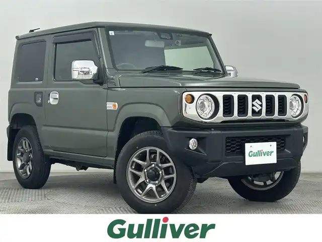 スズキ ジムニー XC 道央・札幌 2019(令1)年 0.7万km ジャングルグリーン ・４WD/・社外メモリーナビ/　CD/DVD/SD/BT/フルセグ/・バックカメラ/・ビルトインETC/・衝突軽減ブレーキ/・クルーズコントロール/・レーンキープアシスト/・前席シートヒーター/・ヘッドライトウォッシャー/・ステアリングスイッチ/・メッキグリル/・メッキテールカバー/・純正マッドフラップ/・LEDヘッドライト/・フォグライト/・オートライト/・純正フロアマット/・ドアバイザー