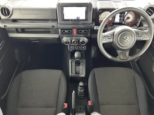 スズキ ジムニー シエラ JC 佐賀県 2025(令7)年 0.1万km ミディアムグレー 社外7インチナビ /Bluetooth/CD/SD/FM.AM/スズキレーダーブレーキサポートシステム/コーナーセンサー/クルーズコントロール/パートタイム4WD/アイドリングストップ/ダウンヒルアシストコントロール/運転席/助手席シートヒーター/社外フロアマット/純正15インチアルミホイール/スマートキー×2/保証書/取扱説明書
