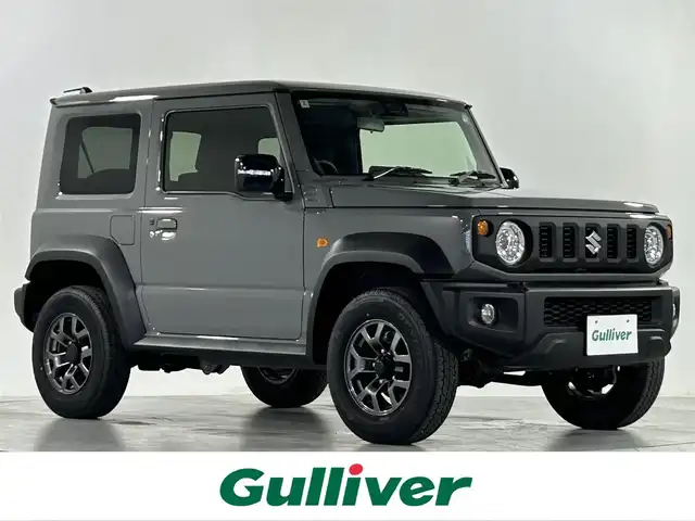 スズキ ジムニー シエラ JC 佐賀県 2025(令7)年 0.1万km ミディアムグレー 社外7インチナビ /Bluetooth/CD/SD/FM.AM/スズキレーダーブレーキサポートシステム/コーナーセンサー/クルーズコントロール/パートタイム4WD/アイドリングストップ/ダウンヒルアシストコントロール/運転席/助手席シートヒーター/社外フロアマット/純正15インチアルミホイール/スマートキー×2/保証書/取扱説明書