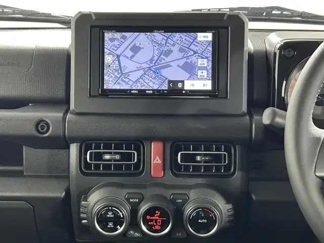 スズキ ジムニー シエラ JC 佐賀県 2025(令7)年 0.1万km ミディアムグレー 社外7インチナビ /Bluetooth/CD/SD/FM.AM/スズキレーダーブレーキサポートシステム/コーナーセンサー/クルーズコントロール/パートタイム4WD/アイドリングストップ/ダウンヒルアシストコントロール/運転席/助手席シートヒーター/社外フロアマット/純正15インチアルミホイール/スマートキー×2/保証書/取扱説明書