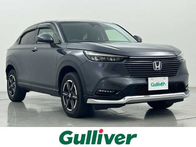 ホンダ ヴェゼル ハイブリッド e:HEV X 熊本県 2022(令4)年 1.1万km メテオロイドグレーメタリック ワンオーナー　/純正前後ドライブレコーダー　/純正ナビ（CD・DVD・フルセグ・BT・USB/Aタイプ）/バックカメラ　　/前後クリアランスソナー　/ホンダセンシング/・アダブティブクルーズコントロール/・路外逸脱制御機能/・踏み間違い防止/・標識認識機能/・衝突軽減ブレーキ/・オートハイビーム/・レーンキープアシスト/横滑り防止/アイドリングストップ/ダウンヒルアシスト/電動パーキングブレーキ/ブレーキホールド/純正フロアマット/純正１６インチAW/オートライト/LEDヘッドライト/フォグライト/スマートキー/プッシュスタート/保証書/取扱説明書
