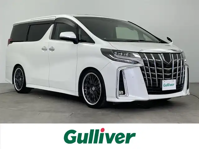 トヨタ アルファード S Cパッケージ 大分県 2018(平30)年 5.7万km ホワイトパールクリスタルシャイン ワンオーナー/ウェッズ・マーベリックアルミホイル20インチ/アルパイン11インチナビ/アルパインフリップダウンモニター/アルパインリフトアップスピーカー/社外ウーファー/Ti2000ローダウンサスペンション/LEDイエローバルブフォグランプ/サンルーフ/トヨタセーフティーセンス/シートメモリー/コーナーセンサー/ステアリングヒーター/バックカメラ/パワーシート/ウッドコンビハンドル・シフトノブ/ビルトインETC/ドライブレコーダー
