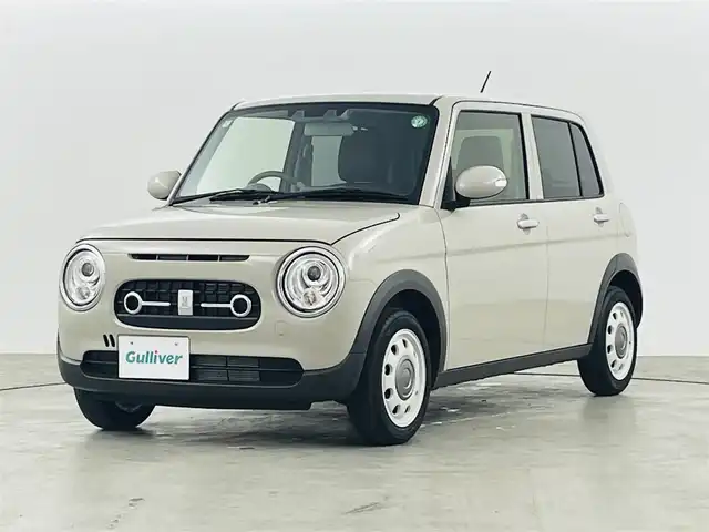スズキ ラパン X 福島県 2024(令6)年 0.7万km フォーンベージュM 純正ディスプレイオーディオ/【USB/Bluetooth/AppleCarPlay/AndroidAuto】/・バックカメラ/衝突軽減ブレーキ/レーンキープアシスト/車線逸脱警報装置/コーナーセンサー/ハーフレザーシート/・運転席＋助手席シートヒーター/革巻きステアリング/・ステアリングスイッチ/LEDヘッドライト/・オートライト/電動格納ミラー/ABS/横滑り防止装置/盗難防止装置/社外フロアマット/プッシュスタート/・スマートキー/・スペアキー