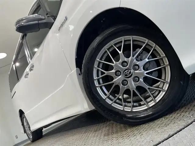 トヨタ ヴォクシー ハイブリッド ZS 煌Ⅱ 愛知県 2019(令1)年 3.9万km ホワイトパールクリスタルシャイン 純正10インチナビ/（フルセグTV／CD／DVD／Bluetooth／FM／AM）/リア天井スピーカー/純正ビルトインETC/両側電動スライドドア/シートヒーター/トヨタセーフティセンス/衝突軽減ブレーキ/クルーズコントロール/バックカメラ/コーナーセンサー/オートハイビーム/純正ドライブレコーダー/USB充電