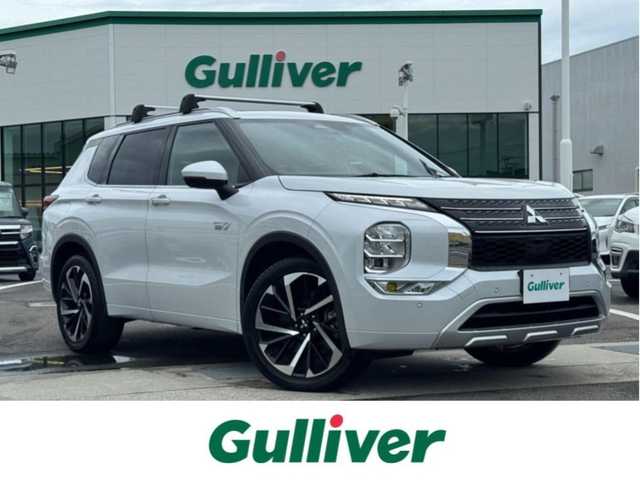 三菱 アウトランダー ＰＨＥＶ P 愛媛県 2021(令3)年 4.1万km クリスタルホワイト 〇BOSEサウンド/〇純正スマホ連携ナビ/〇フルセグTV/〇ビルトインETC2.0/〇4WD/〇ワンオーナー/〇マルチアラウンドモニター/〇ワイヤレス充電 /〇USBポート/〇レーダークルーズコントロール/〇車線維持支援機能/〇衝突被害軽減ブレーキシステム/〇踏み間違い衝突防止アシスト/〇車線逸脱警報システム/〇車線逸脱防止支援機能/〇ふらつき警報/〇前方衝突予測警報/〇標識認識システム/〇後側方衝突被害防止支援システム/〇後側方車両検知警報システム/〇後退時車両検知警報システム/〇キーレスオペレーションキー/〇パワースイッチ/〇ハンズフリーパワーバックドア/〇セミアニリン本革シート/〇全後席シートヒーター/〇メモリーPシート/〇リフレッシュ機能付/〇ルーフレール/〇パワーゲート/〇LEDヘッドランプ/〇LEDフロントフォグランプ/〇LEDデイタイムランニングランプ/〇純正20インチアルミホイール/〇革巻きステアリングホイール/〇ステアリングヒーター/〇左右後席独立温度調整オートエアコン/〇禁煙車