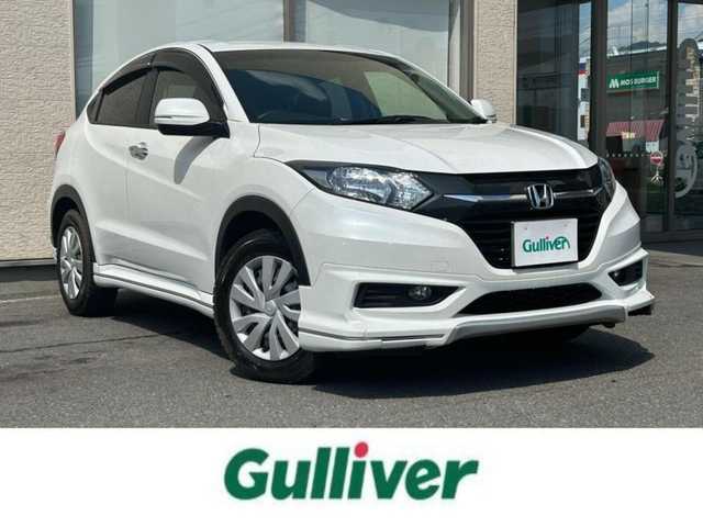 ホンダ ヴェゼル G 大阪府 2015(平27)年 0.5万km ホワイトオーキッドパール ・4WD/・寒冷地仕様/・純正ナビ/・バックカメラ/・フルセグ/・CD/BT/USB/・プッシュスタート/・スマートキー/・横滑り防止/・ワイパーデアイサー/・アイドリングストップ/・ETC/・ミラーヒーター/・電動格納ウィンカーミラー/・社外AW付夏タイヤ積込/・純正フロアマット/・ドアバイザー/・保証書・取説あり