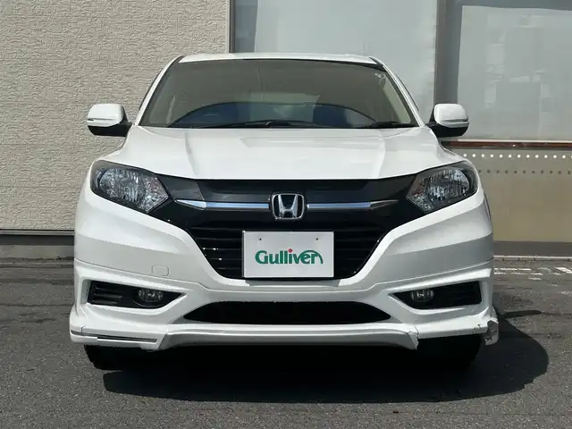 ホンダ ヴェゼル G 大阪府 2015(平27)年 0.5万km ホワイトオーキッドパール ・4WD/・寒冷地仕様/・純正ナビ/・バックカメラ/・フルセグ/・CD/BT/USB/・プッシュスタート/・スマートキー/・横滑り防止/・ワイパーデアイサー/・アイドリングストップ/・ETC/・ミラーヒーター/・電動格納ウィンカーミラー/・社外AW付夏タイヤ積込/・純正フロアマット/・ドアバイザー/・保証書・取説あり
