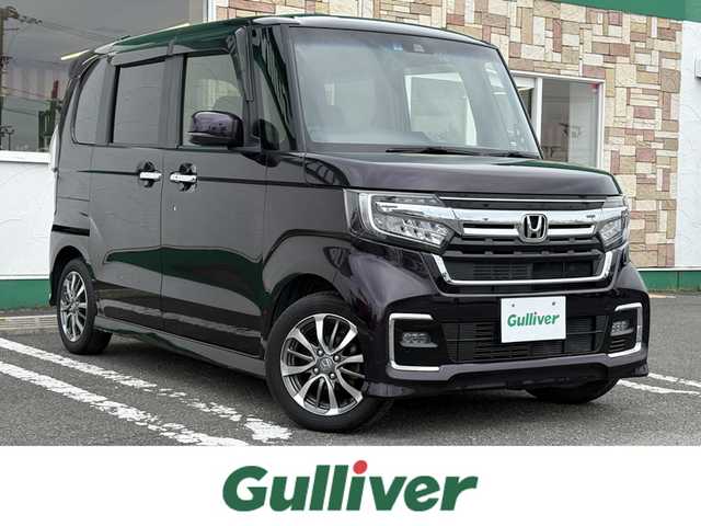 ホンダ Ｎ ＢＯＸ カスタム L 徳島県 2021(令3)年 2.7万km プレミアムベルベットパープル・パール 社外ナビゲーション　/（フルセグ/CD/DVD/SD/Bluetooth）/バックモニター　/社外ドライブレコーダー　/ホンダセンシング/・アダプティブ・クルーズ・コントロール（ACC）/・車線維持支援システム（LKAS）/・衝突軽減ブレーキ（CMBS）/・誤発進抑制機能（前進）/・歩行者事故低減ステアリング/・路外逸脱抑制機能/・先行車発進お知らせ機能/・標識認識機能/・オートハイビーム/・誤発進抑制機能（後進）/片側パワースライドドア　/トラクションコントロール　/ＬＥＤヘッドライト　/ＬＥＤフォグランプ　/ステアリングリモコン/ウィンカーミラー　/リヤワイパー/プッシュスタート　/スマートキー/カーテンエアバック/純正フロアマット