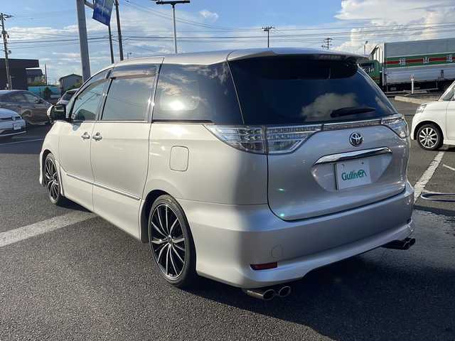 トヨタ エスティマ アエラス プレミアムエディション 新潟県 2013(平25)年 8万km シルバーM 9インチSDナビ/（DTV/DVD/Bluetooth）/11.2インチフリップダウン/バックカメラ/ビルドインETC/クルーズコントロール/ドラレコ/黒ハーフレザー/オットマン/両側パワースライドドア/HIDヘッドライト/フォグランプ/ウィンカーミラー/電格ミラー/ドアバイザー/モデリスタエアロ/ウェッズアルミホイール/社外マフラー