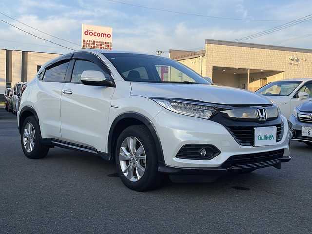 ホンダ ヴェゼル ハイブリッド X ホンダセンシング 山形県 2019(平31)年 4.6万km プラチナホワイトパール Honda SENSING/・衝突軽減ブレーキ（ＣＭＢＳ）/・路外逸脱抑制機能/・先行車発進お知らせ機能/・アダプティブクルーズコントロール（ＡＣＣ）/・車線維持支援システム（ＬＫＡＳ）/・標識認識機能/・誤発進抑制機能 /パドルシフト/純正ナビ/CD.DVD.BT.USB.SD/バックカメラ/フルセグ/ETC/電動パーキングブレーキ/オートホールド/純正エンジンスターター/プッシュスタート/スマートキーｘ２/ＬＥＤヘッドライト