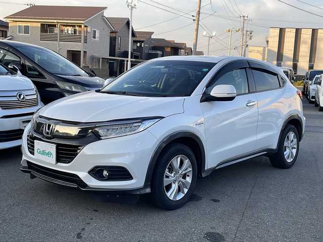 ホンダ ヴェゼル ハイブリッド X ホンダセンシング 山形県 2019(平31)年 4.6万km プラチナホワイトパール Honda SENSING/・衝突軽減ブレーキ（ＣＭＢＳ）/・路外逸脱抑制機能/・先行車発進お知らせ機能/・アダプティブクルーズコントロール（ＡＣＣ）/・車線維持支援システム（ＬＫＡＳ）/・標識認識機能/・誤発進抑制機能 /パドルシフト/純正ナビ/CD.DVD.BT.USB.SD/バックカメラ/フルセグ/ETC/電動パーキングブレーキ/オートホールド/純正エンジンスターター/プッシュスタート/スマートキーｘ２/ＬＥＤヘッドライト