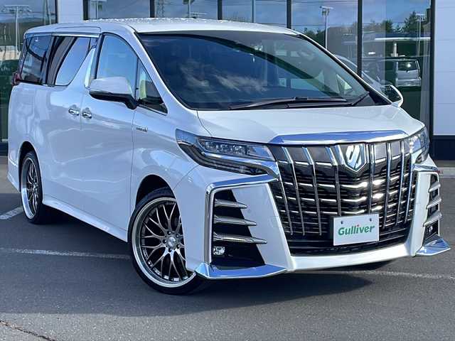 トヨタ アルファードハイブリット SR Cパッケージ 道東・釧路十勝 2018(平30)年 3.6万km ホワイトパールクリスタルシャイン ・4WD/・社外8インチSDナビ/（BT・フルセグ・CD・DVD・FM・AM）/・バックカメラ/・10.2インチフリップダウンモニター/・両側パワースライドドア/・レーダークルーズコントロール/・レーンキープアシスト/・コーナーセンサー/・横滑り防止/・パワーバックドア/・シートヒーター/エアーシート/・ステアリングヒーター/・前席パワーシート/・三眼LEDヘッドライト/・オートライト/・オートマチックハイビーム/・ステアリングスイッチ/・ビルトインETC/・AC100V（1500W）/・デジタルインナーミラー/・オットマン/・電格ウィンカーミラー/・スマートキー/・プッシュスタート