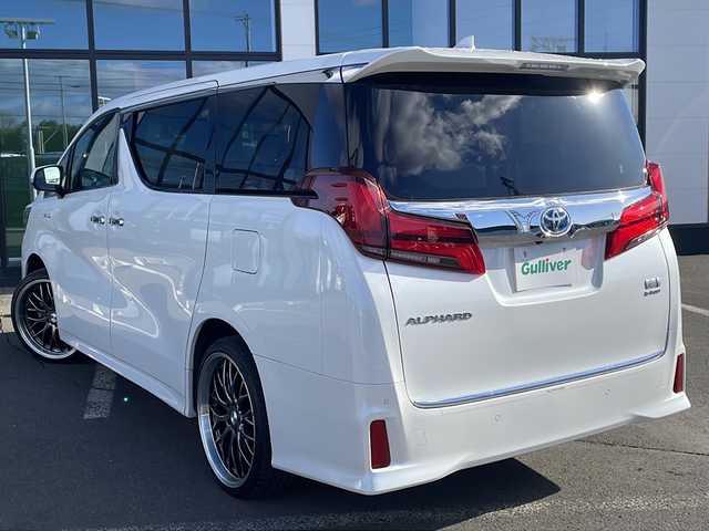 トヨタ アルファードハイブリット SR Cパッケージ 道東・釧路十勝 2018(平30)年 3.6万km ホワイトパールクリスタルシャイン ・4WD/・社外8インチSDナビ/（BT・フルセグ・CD・DVD・FM・AM）/・バックカメラ/・10.2インチフリップダウンモニター/・両側パワースライドドア/・レーダークルーズコントロール/・レーンキープアシスト/・コーナーセンサー/・横滑り防止/・パワーバックドア/・シートヒーター/エアーシート/・ステアリングヒーター/・前席パワーシート/・三眼LEDヘッドライト/・オートライト/・オートマチックハイビーム/・ステアリングスイッチ/・ビルトインETC/・AC100V（1500W）/・デジタルインナーミラー/・オットマン/・電格ウィンカーミラー/・スマートキー/・プッシュスタート