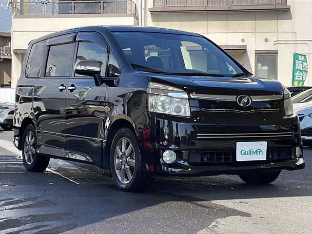 トヨタ ヴォクシー ZS 煌Ⅱ 岡山県 2010(平22)年 15.1万km ブラック 登録時走行距離150258km/社外SDナビ/(AM/FM/TV/DISC/BT)/両側パワースライドドア/ビルトインETC/バックカメラ/MTモード付AT/パドルシフト/ウォークスルー/プッシュスタート/スマートキー/純正１６インチアルミホイール/ハロゲンヘッドライト/USB入力端子/記録簿/取扱説明書