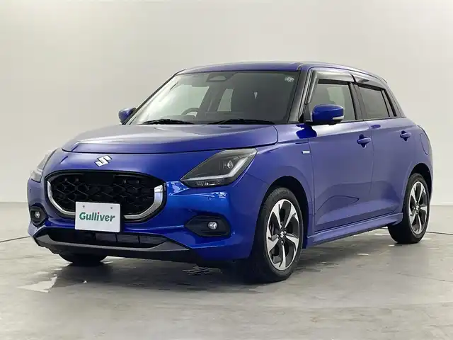 スズキ スイフト HYBRID MZ 福井県 2024(令6)年 1万km 青 純正9型メモリナビ/（CD・DVD・TV・FM・AM・Bluetooth・USB・Ipod・HDMI・AppleCArPlay・AndroidAuto）/全方位カメラ /スペアキー　/電子パーキング/純正ビルトインETC /シートヒーター /純正アルミホイール /前後センサー/LEDヘッドライト/ABS/レーンキープアシスト/横滑り防止装置/オートライト/LEDヘッドライト