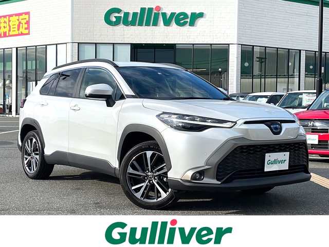 トヨタ カローラ クロス ハイブリッド Z 鳥取県 2022(令4)年 2.6万km プラチナホワイトパールマイカ 純正9インチナビ/フルセグ/CD/DVD/BT/バックカメラ・ETC2.0/前後ドライブレコーダー/トヨタセーフティセンス/ブラインドスポットモニター/レーンキープアシスト/レーダークルーズコントロール/ハーフレザーシート/運転席パワーシート/前席シートヒーター/パワーバックドア/LEDヘットライト/純正18インチアルミホイール/プッシュエンジンスタート/スペアキー