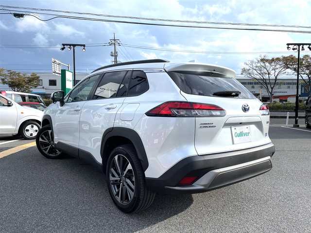 トヨタ カローラ クロス ハイブリッド Z 鳥取県 2022(令4)年 2.6万km プラチナホワイトパールマイカ 純正9インチナビ/フルセグ/CD/DVD/BT/バックカメラ・ETC2.0/前後ドライブレコーダー/トヨタセーフティセンス/ブラインドスポットモニター/レーンキープアシスト/レーダークルーズコントロール/ハーフレザーシート/運転席パワーシート/前席シートヒーター/パワーバックドア/LEDヘットライト/純正18インチアルミホイール/プッシュエンジンスタート/スペアキー