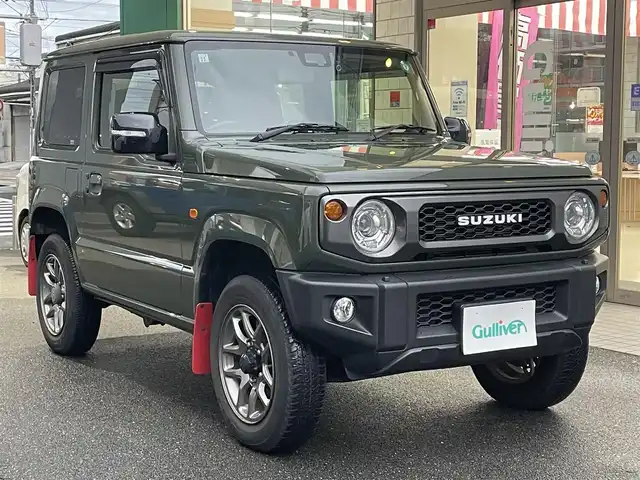 スズキ ジムニー XC 愛知県 2021(令3)年 4.2万km ジャングルグリーン KENWOODナビ〈MDV-709BT〉/・Bluetooth／地デジTV/USB/・SD/DVD/HDMI/Clazzio製レザー調シートカバー/前席シートヒーター/純正マッドフラップ/スズキセーフティサポート/・デュアルセンサーブレーキサポート/・誤発進抑制機能/・車線逸脱警報/・ふらつき警報/クルーズコントロール/ヒルディセントコントロール/アンテナ分離型ETC/KENWOODドライブレコーダー〈DRV-MR450〉/ヘッドライトウォッシャー