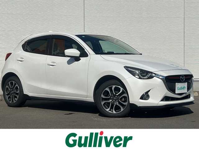 マツダ デミオ XD ツーリング Lパッケージ 秋田県 2015(平27)年 8.3万km スノーフレイクホワイトパールマイカ ターボ/４WD/衝突軽減システム/LEDヘッドライト/純正SDナビ（DVD/CD再生可能）/フルセグ/バックカメラ/マツダ純正１６インチアルミ（夏タイヤ装着）/スマートキー/アイドリングストップ/プッシュスタート/マツダ・レーダークルーズコントロール追従走行無/オートマチックハイビーム/レーンキープアシスト/MTモード付AT/ステアリングスイッチ/ビルトインETC/ブラインドスポットモニター/パドルシフト/純正エンジンスターター/純正フロアマット/社外ドアバイザー/オートライト/オートエアコン/パワーステアリング/パワーウィンドウ/横滑り防止/盗難防止装置/寒冷地仕様/電動格納ウィンカーミラー/キーレスエントリー/保証書/取扱説明書/記録簿/スペアキー1本有