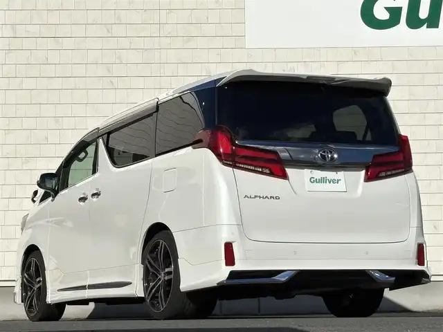 トヨタ アルファード S タイプゴールドⅡ 岩手県 2022(令4)年 2.1万km ホワイトパールクリスタルシャイン 禁煙車/4WD/モデリスタフルエアロ/純正フリップダウンモニター/ディスプレイオーディオナビ/→フルセグTV/Bluetooth/FM/AM/バックカメラ/両側パワースライドドア/パワーバックドア/ローダウン（TEIN）/社外20インチAW/ハーフレザー/ステアリングスイッチ/トヨタセーフティセンス/追従型クルーズコントロール/ブラインドスポットモニター/レーンキープアシスト/衝突軽減システム/前後コーナーセンサー/横滑り防止装置/電子パーキング/オートブレーキホールド/オートライト/オートハイビーム/LEDヘッドライト/LEDフォグライト/〇プッシュスタート/〇電動格納ミラー/〇ウィンカーミラー/〇ドアバイザー/〇フロアマット/〇シガーソケット/〇USBポート/前後ドライブレコーダー/ビルトインETC/冬タイヤ社外アルミホイール車載