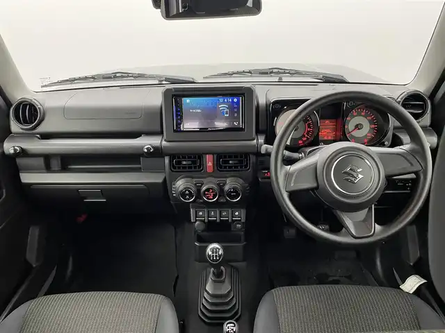 スズキ ジムニー XL 熊本県 2021(令3)年 2.3万km ミディアムグレー ワンオーナー　/禁煙車　/5速MT/ディスプレイオーディオ/バックカメラ　/社外全周囲ドラレコ　/ＥＴＣ２．０　/社外マフラー/前席シートヒーター　/ダウンヒルアシスト　/横滑り防止　/電動格納ミラー/スマートキー/プッシュスタート/スペアキー1本/保証書/取扱説明書