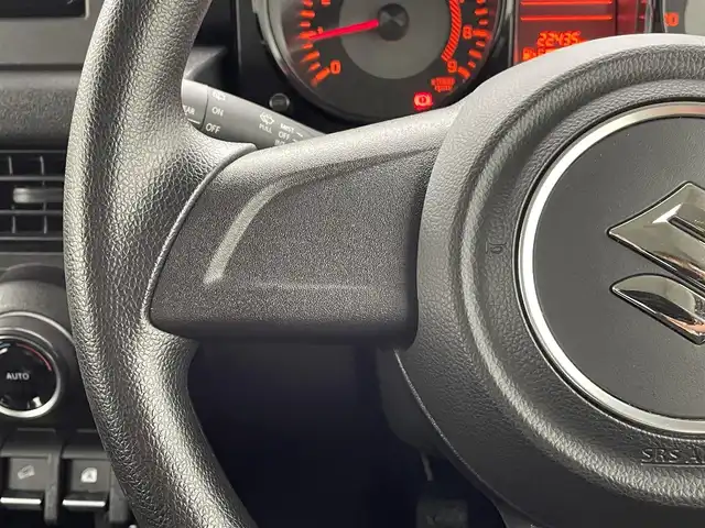スズキ ジムニー XL 熊本県 2021(令3)年 2.3万km ミディアムグレー ワンオーナー　/禁煙車　/5速MT/ディスプレイオーディオ/バックカメラ　/社外全周囲ドラレコ　/ＥＴＣ２．０　/社外マフラー/前席シートヒーター　/ダウンヒルアシスト　/横滑り防止　/電動格納ミラー/スマートキー/プッシュスタート/スペアキー1本/保証書/取扱説明書