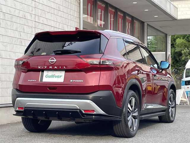 日産 エクストレイル G e－4ORCE 埼玉県 2024(令6)年 1.8万km 赤 ワンオーナー/NISMOエアロパーツ/キャメルレザー/パノラマサンルーフ/プロパイロット/パワーバックドア/パーキングアシスト/純正19インチアルミ/サイドステップ/全席シートヒーター/デジタルルームミラー/純正ナビTV/アラウンドビューモニター/ダウンヒルアシスト/LEDヘッドライト/FRコーナーセンサー/ハンドル支援/ETC/新車保証書/取扱説明書